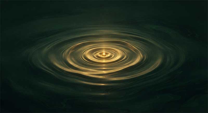 Abstract golden light rippling outward in water, representing the risk of overhydration