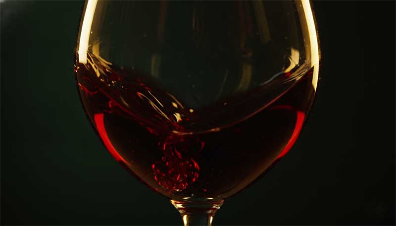 Liquid swirling in a glass, representing blood flow research on nattokinase