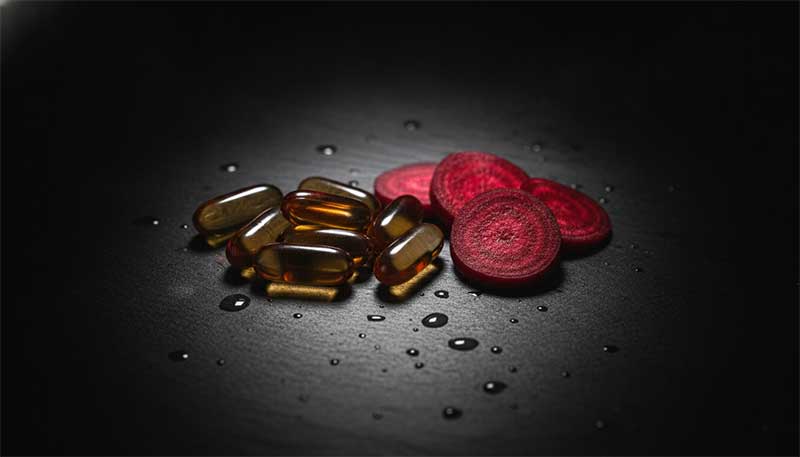 TMG supplement capsules with fresh beetroot