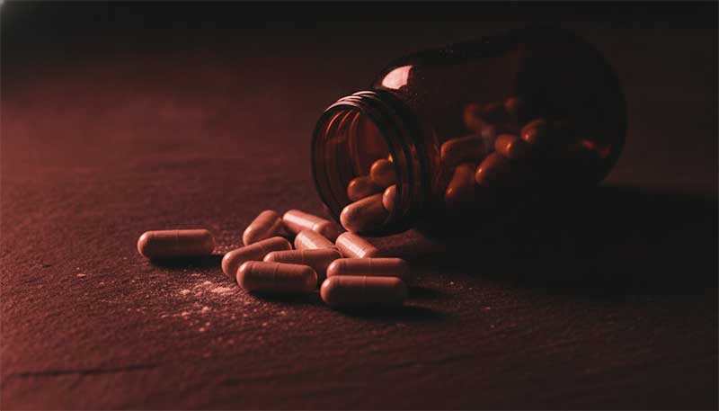 Supplement bottle with warning glow
